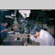 Men seated at work benches (ddr-densho-426-555)