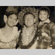 A man, woman, and child wearing leis (ddr-njpa-1-485)