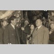 Man with a crowd holding flags (ddr-njpa-4-2405)