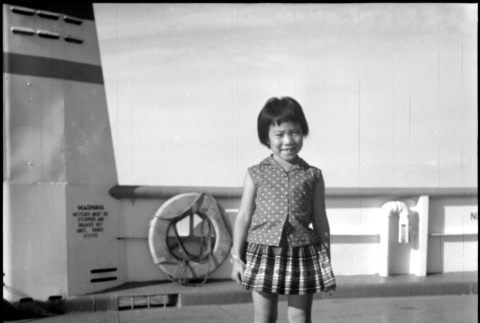 Girl standing on ferry deck, likely Kris Domoto (ddr-densho-329-709)