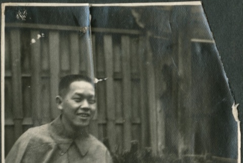 A man seated in a garden (ddr-densho-321-632)
