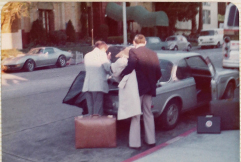 Men loading trunk of car (ddr-densho-426-1228)