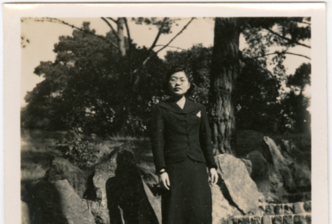 Tomoye (Nozawa) Takahashi standing on stone steps (ddr-densho-426-2100)