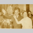 Alfred M. Landon and his wife, Theo Cobb waving at an event (ddr-njpa-1-852)
