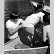 Robert Hanashiro and Carrie Sakai in a boat (ddr-densho-336-575)