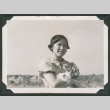 Suzie Shiota carrying cat (ddr-densho-550-163)