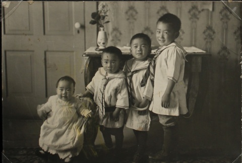 Four Nisei children at home (ddr-densho-259-32)
