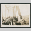 2 kids on a train bridge (ddr-densho-378-381)