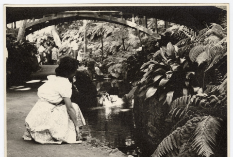 Woman kneeling by a stream (ddr-densho-542-825)