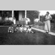 Family outside their home (ddr-densho-34-101)