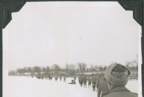Line of men walking in snow (ddr-ajah-2-448)