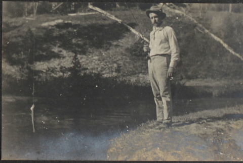 Man fishing at Yellowstone Park (ddr-densho-355-655)
