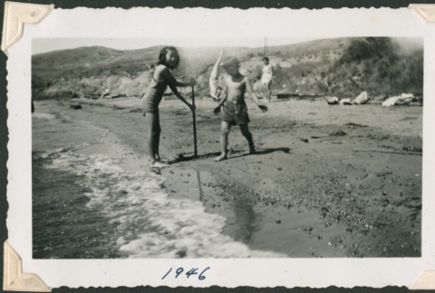 Girl and boy playing at the beach (ddr-densho-321-162)