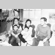 Japanese American family inside barracks (ddr-densho-39-28)