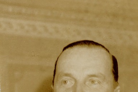A man wearing leis (ddr-njpa-1-2582)