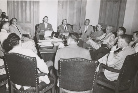 William F. Quinn and several others seated around a desk (ddr-njpa-2-1018)