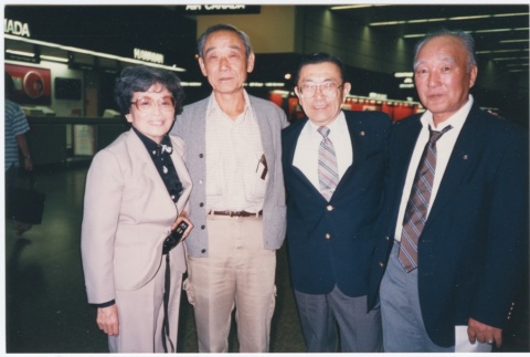 Group at SeaTac Airport on the way to the ceremony for the signing of the Civil Liberties Act of 1988 (ddr-densho-10-201)
