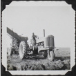 A tractor in the field (ddr-densho-300-504)