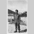 [Man in military uniform standing outside] (ddr-csujad-1-32)