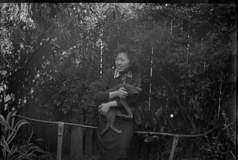 Tomoye (Nozawa) Takahashi holding a cat (ddr-densho-426-1747)