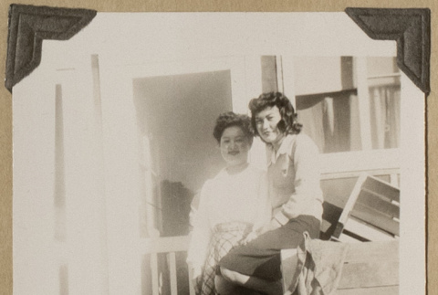 Lillian Uyeda and Hide on a porch (ddr-densho-542-421)