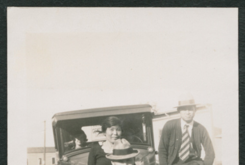 Family photo with car (ddr-densho-378-414)
