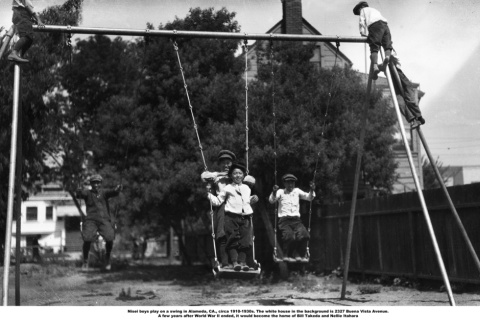 Boys playing on swings (ddr-ajah-6-740)
