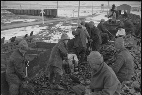 Japanese Americans unloading coal (ddr-densho-37-385)