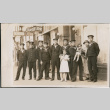 Group of Japanese sailors posing with family outside Hotel Oregon (ddr-densho-483-554)