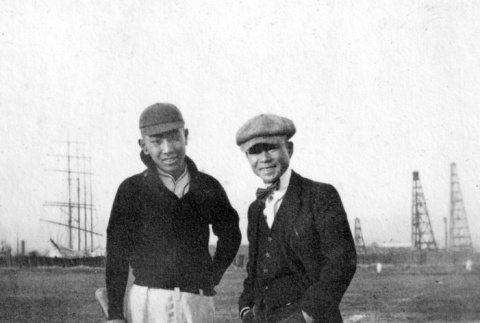 Two men standing in baseball field (ddr-ajah-5-70)