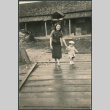 Woman and toddler on boardwalk (ddr-densho-523-81)