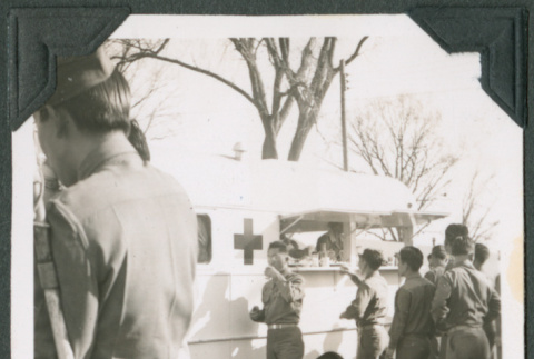 Group of men by Red Cross canteen truck (ddr-ajah-2-473)