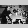 Priest and children at table (ddr-densho-330-261)