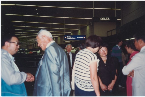 Group at SeaTac Airport on the way to the ceremony for the signing of the Civil Liberties Act of 1988 (ddr-densho-10-183)