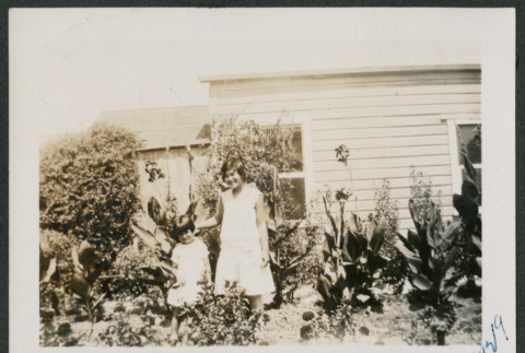 Two girls in garden (ddr-densho-378-624)