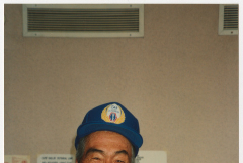 Veteran wearing commemorative baseball cap (ddr-densho-368-395)