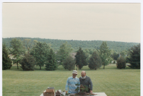 Kaneji Domoto with unidentified man at Bonsai demonstration (ddr-densho-377-3012)