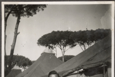 Man standing outside tent (ddr-densho-466-36)
