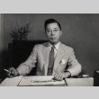 Masahide Kanayama at his desk (ddr-njpa-4-625)