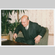 Hugh Nozawa in chair (ddr-densho-1007-407)