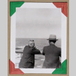 Two men gaze over the rail of a ship (ddr-densho-404-338)
