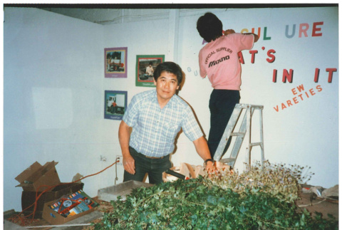 Norm and Trainee setting up exhibit (ddr-densho-441-43)