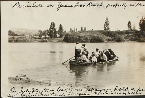Party crossing Mosier Lake on a rowboat (ddr-densho-259-132)