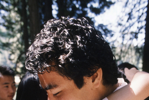 James Hanashiro hugging a fellow camper during communion (ddr-densho-336-1802)
