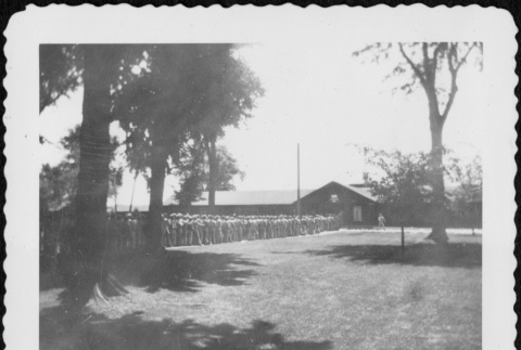 Long line of men entering building (ddr-densho-434-397)