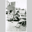 Soldier with gun on tripod (ddr-densho-1007-781)