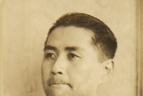 Young man wearing leis (ddr-njpa-4-2101)