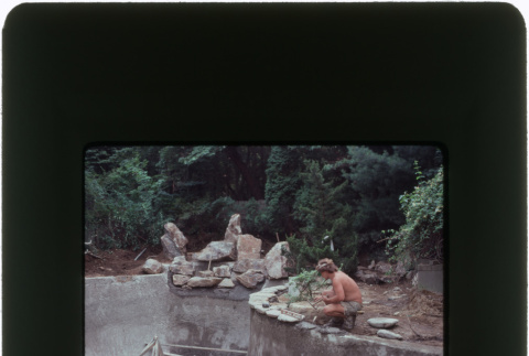 Construction on a pool and rock garden (ddr-densho-377-1135)