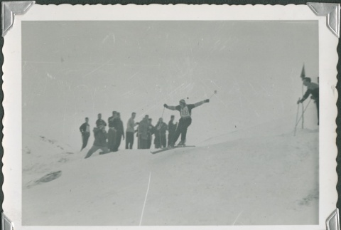 Crowd watching a skier clear a jump (ddr-densho-321-425)