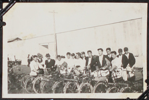 Group with bike in baseball uniforms (ddr-densho-326-239)